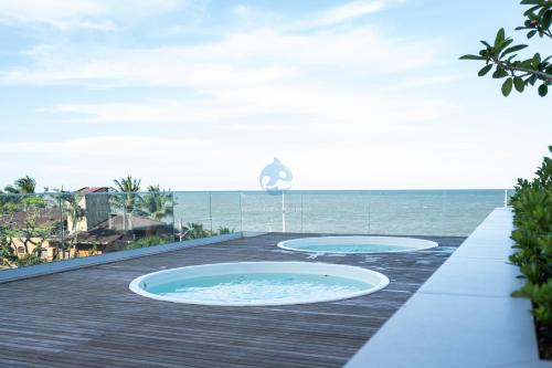 Itacolomi Apartment | Apto em condomínio Pé na areia 3 Quartos Cozinha Completa Sacada com Churrasqueira Vaga de Garagem Piscina borda infinita Academia Quadra de esportes Sala de Jogos Summer Home Club acesso direto a praia