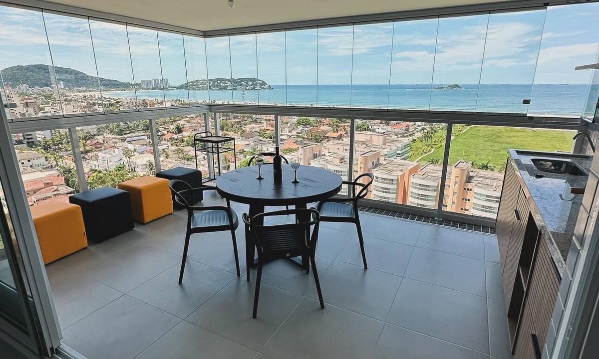 Guaruja Apartment | Beachfront resort apartment with ample facilities, swimming pool, and barbecue on the balcony.
