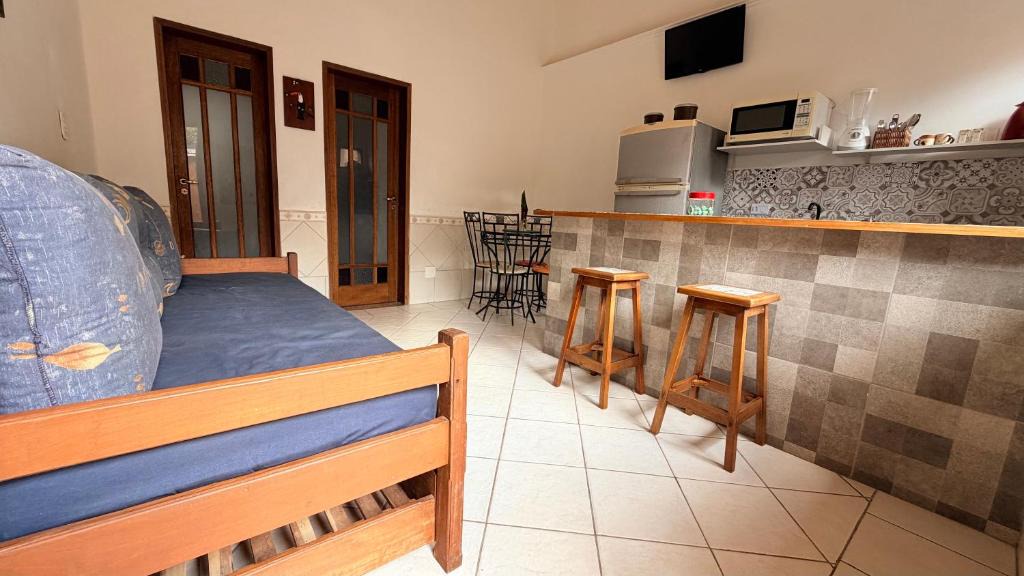 Agua Branca Apartment | Chalé completo com ar condicionado e próximo do Perequê