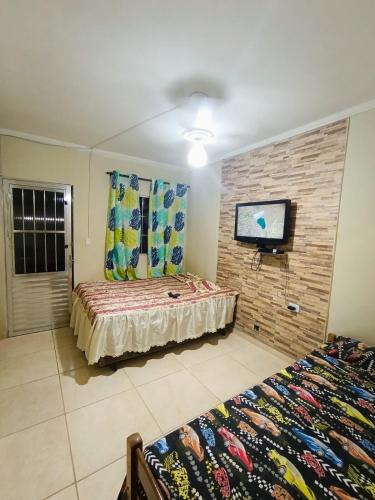 Jardim Virginia House | kitnet family - 2 quadras da praia da Enseada