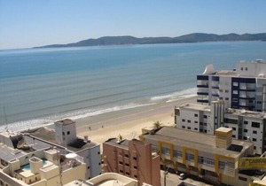 Apt. cover with great views of the sea front promenade, center.(See rates). in Itapema