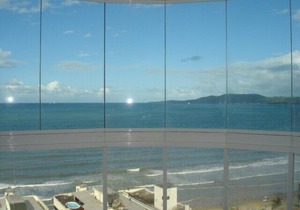 Apt. cover with great views of the sea front promenade, center.(See rates). in Itapema