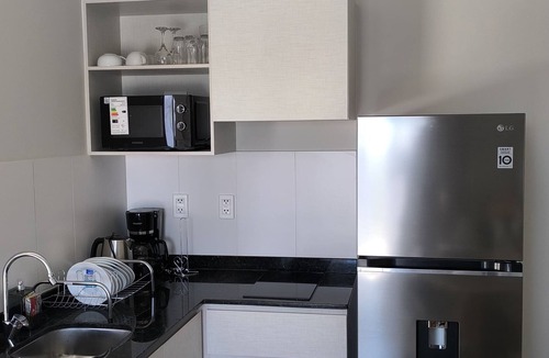 Encarnacion Apartment | Alfina Inn, space created for your comfort, river view, privileged terrace.