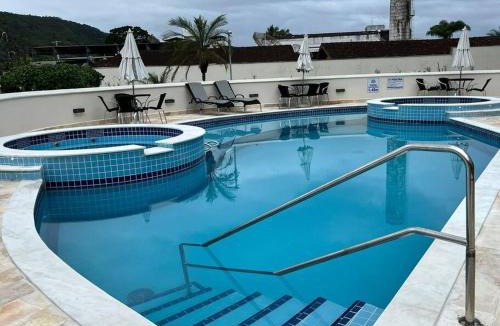 Praia da Enseada Apartment | Apartamento 23A para 6 pessoas com Piscina e Churrasqueira no Cond Torremolinos Beach a 80m para Pé na areia na Praia da Enseada Ubatuba