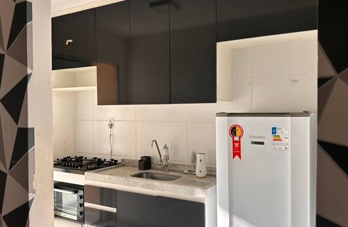 Santa Maria Apartment | Apartment near the airport with a combined balcony, air conditioning, and a hammock.