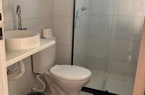 Santa Maria Apartment | Apartment near the airport with a combined balcony, air conditioning, and a hammock.