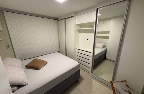 Plano Diretor Sul Apartment | Apartment with AC in living room and bedrooms, with balcony and swimming pool