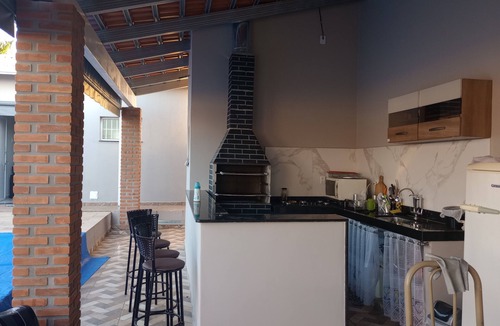 Botucatu House | Leisure area in Rubião Júnior