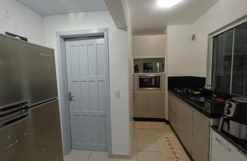Poco Fundo Apartment | Casa com tres quartos e garagem