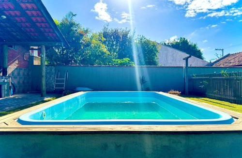 Itacolomi House | Casa Completa com Piscina Churrasqueira Wi-Fi e Garagem para 3 Carros a 500m da Praia Acomoda 11 Pessoas, 4 Quartos e Ar Condicionado