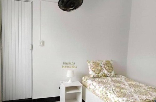 Pereque House | Comfortable accommodation with air conditioning and a fan. Well-Maintained Suite #3
