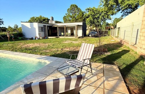 Arroyo Leyes House | Entreverdes, Casas de alquiler - Casa Jacarandá