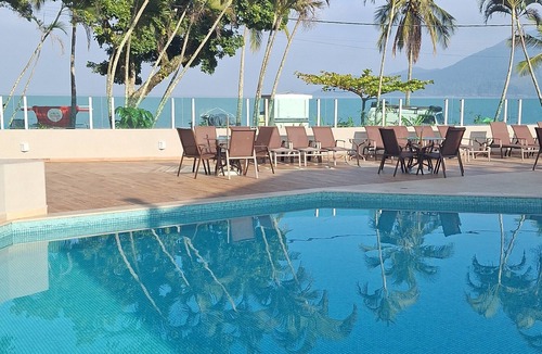 Praia do Pauba Apartment | Flat Praia de Pauba, right on the sand, heated pool, barbecue and sauna.