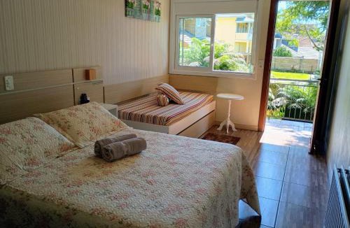 Carniel House | Hospedagem Caminho das Rosas-suítes em Gramado
