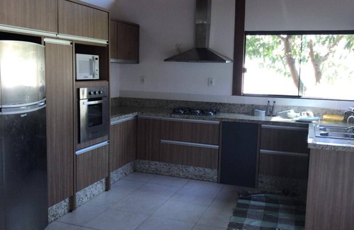 Rio Vermelho Sul House | House next to the woods, beach and lagoon.