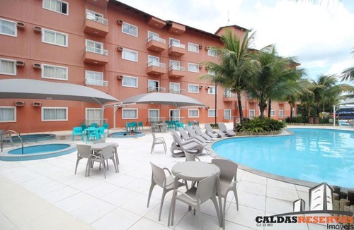 Setor Lagoa Quente Apartment | LAGOA QUENTE HOTEL - Apartamento 229 - 01º Andar - SUÍTE ESMERALDA - 01 quarto, sala, cozinha e banheiro *com fogão*