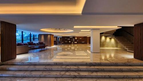 La Perla Apartment | MarDelSuites - Studios Modernos Piso Alto - Vista al Mar, Cochera Opcional, AC, Pileta, 2min Playa