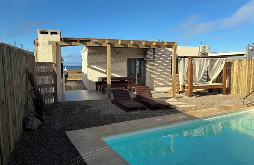 Punta Negra House | Oceanfront, heated pool, barbecue area, pet-friendly, relaxation and comfort