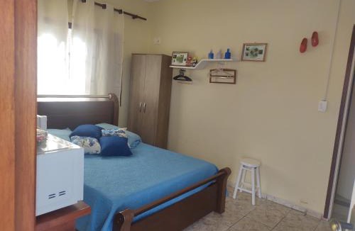 Holambra House | QUARTO CONFORTAVEL COM GARAGEM