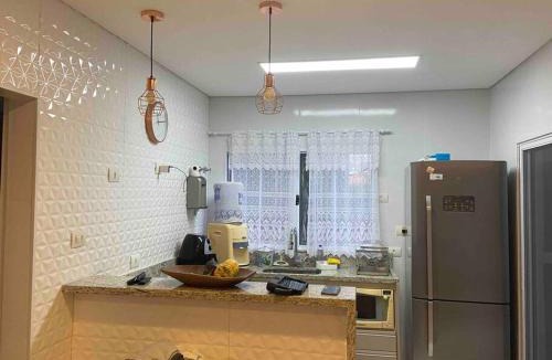 Morada da Praia House | Sobrado moderno, piscina privativa, condomínio Morada da Praia!