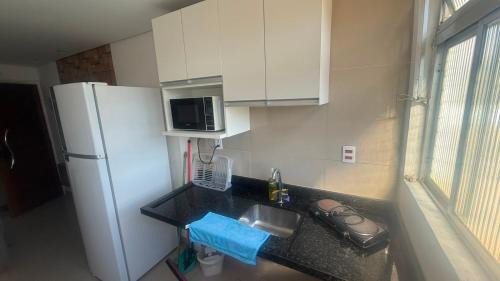 Parque Enseada Apartment | Studio 10 confortável, lazer no condominio, proxima a praia