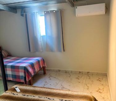 Laranjeiras Apartment | Suíte 06 - Com Ar condicionado perto do Camaru, próximo ao UMC e Uberlândia shopping