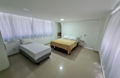 Jardim Oceania House | Suíte Lateral Mar no Na Praia