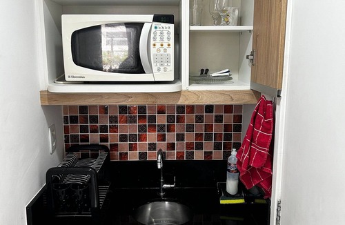 Jacarepagua House | Suite with mini kitchen and pool