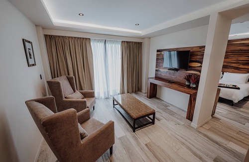 Rio Cuarto Hotel | Unwind in a Nature-Inspired Room with Balcony Views | 0.7 mi to Cathedral Church