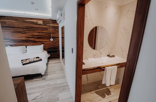 Rio Cuarto Hotel | Unwind in a Nature-Inspired Room with Balcony Views | 0.7 mi to Cathedral Church