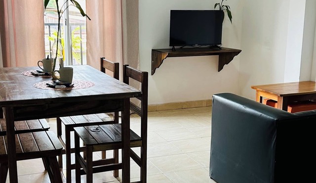 Centrally located room with living room and full kitchen-2C