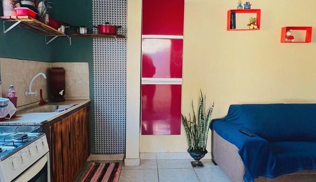 Single-story house with en-suite bathroom, open-plan kitchen, and garage in Goiânia.