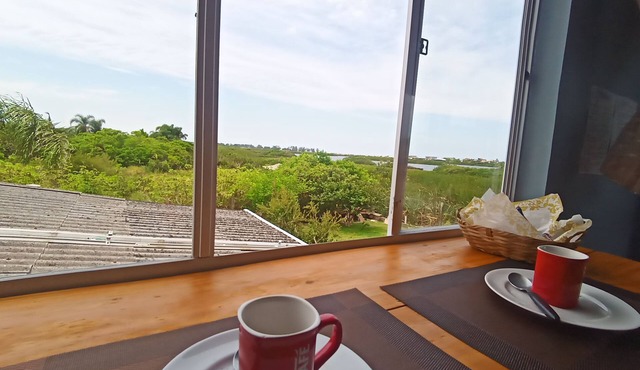 Suite with kitchen, overlooking the lagoon. In Passo de Torres