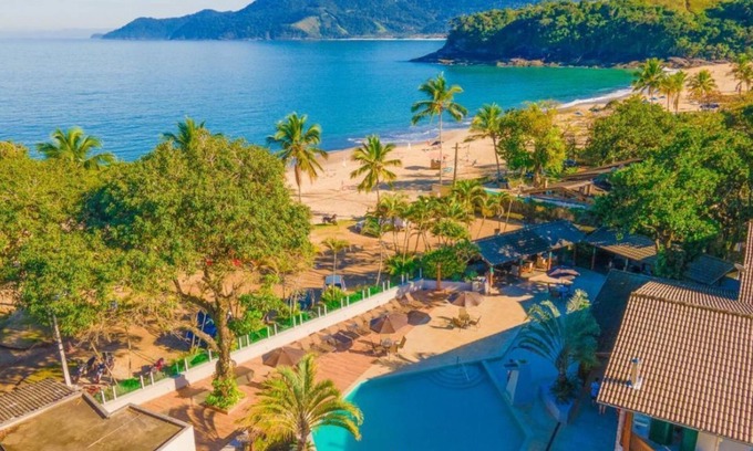 Praia do Pauba Apartment | Flat Praia de Pauba, right on the sand, heated pool, barbecue and sauna.